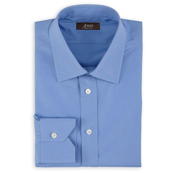 Anto blue poplin dress shirt, neatly folded, showcasing the fabric's texture and the shirt’s elegant design.
