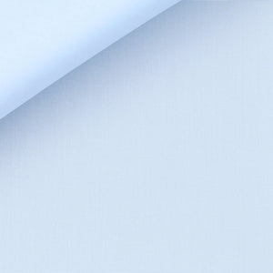 Close-up view of an Anto light blue poplin fabric swatch, highlighting its fine texture and quality.