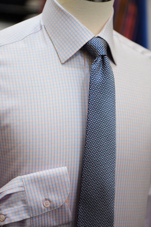 A pink and blue Anto dress shirt and Anto polka dot tie, showcased on a mannequin.