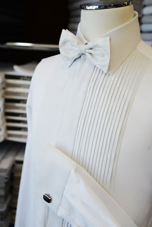 Anto white pleated tuxedo and bow tie, displayed on a mannequin